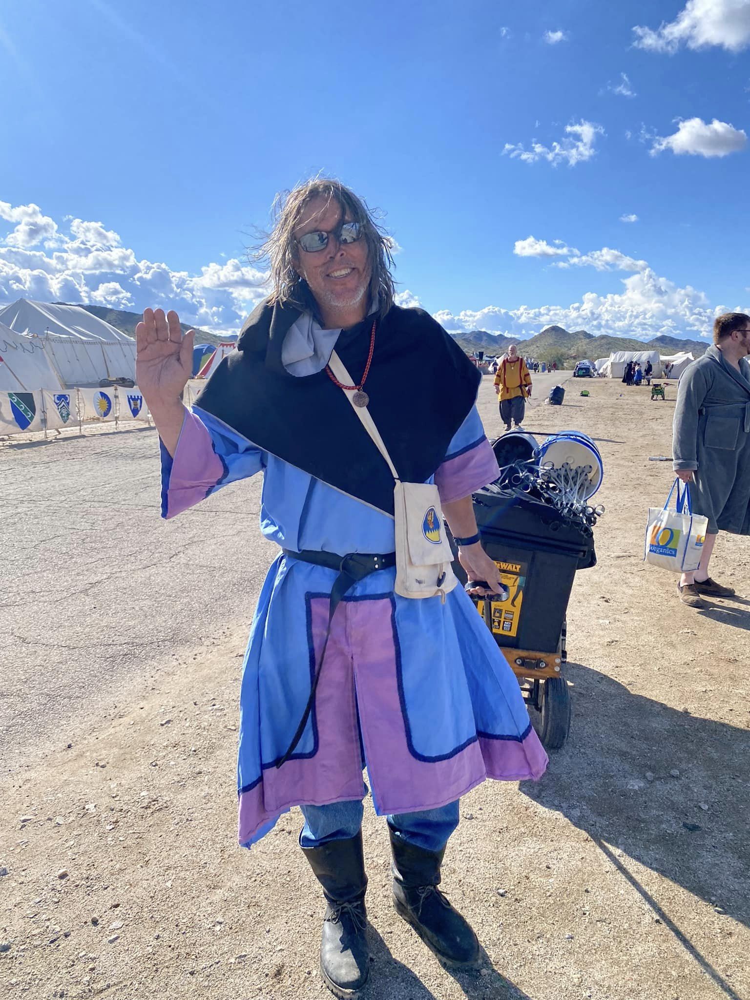 Populace member Flip volunteering for War and waving a friendly greeting.
