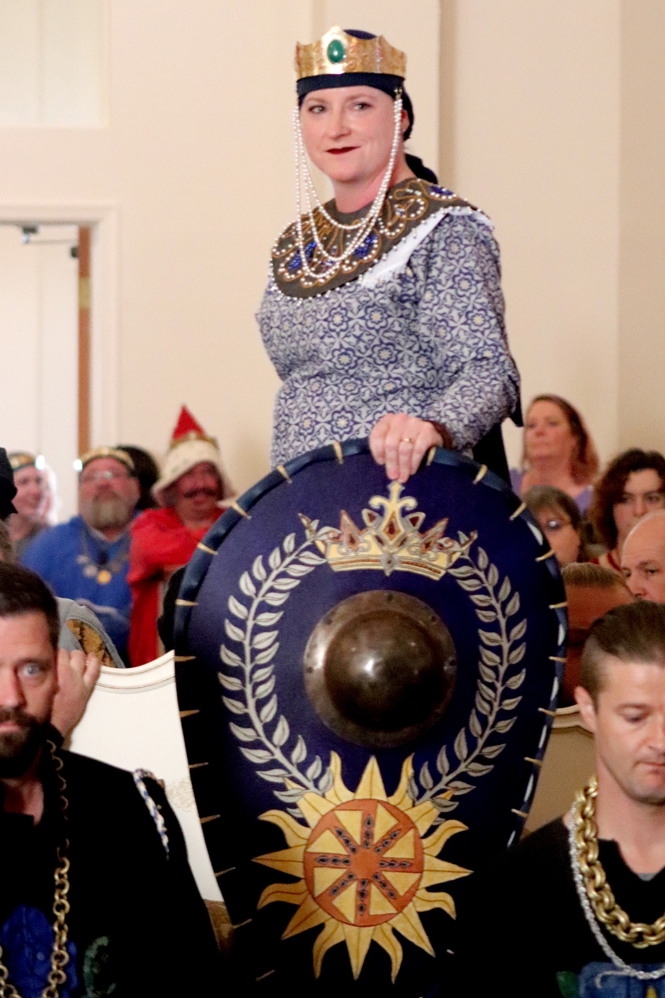 Liz with a beautiful shield HRM Elizabeth being carried in for coronation Fall 2018